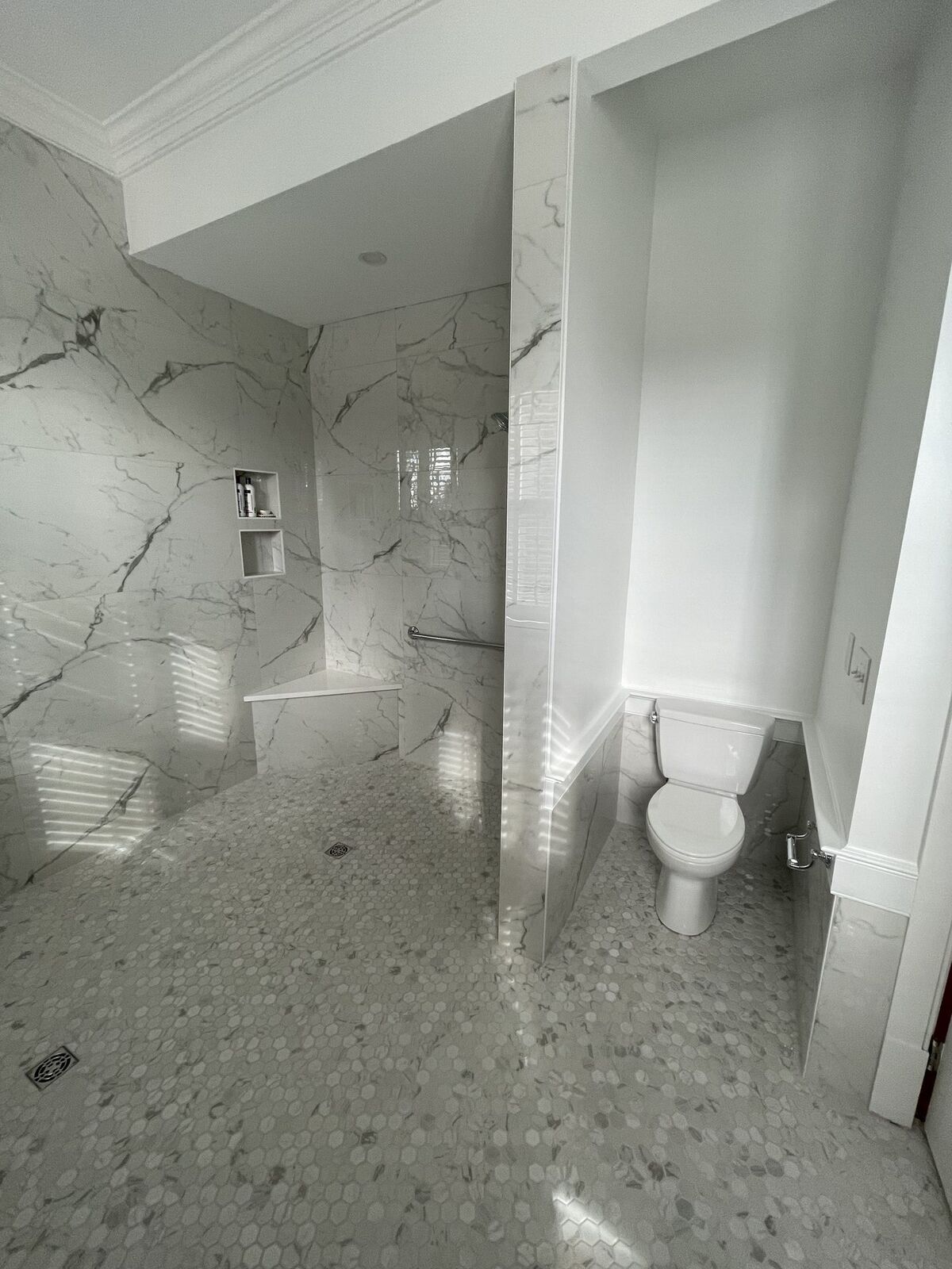 Bathroom renovation with custom tile and a glass shower