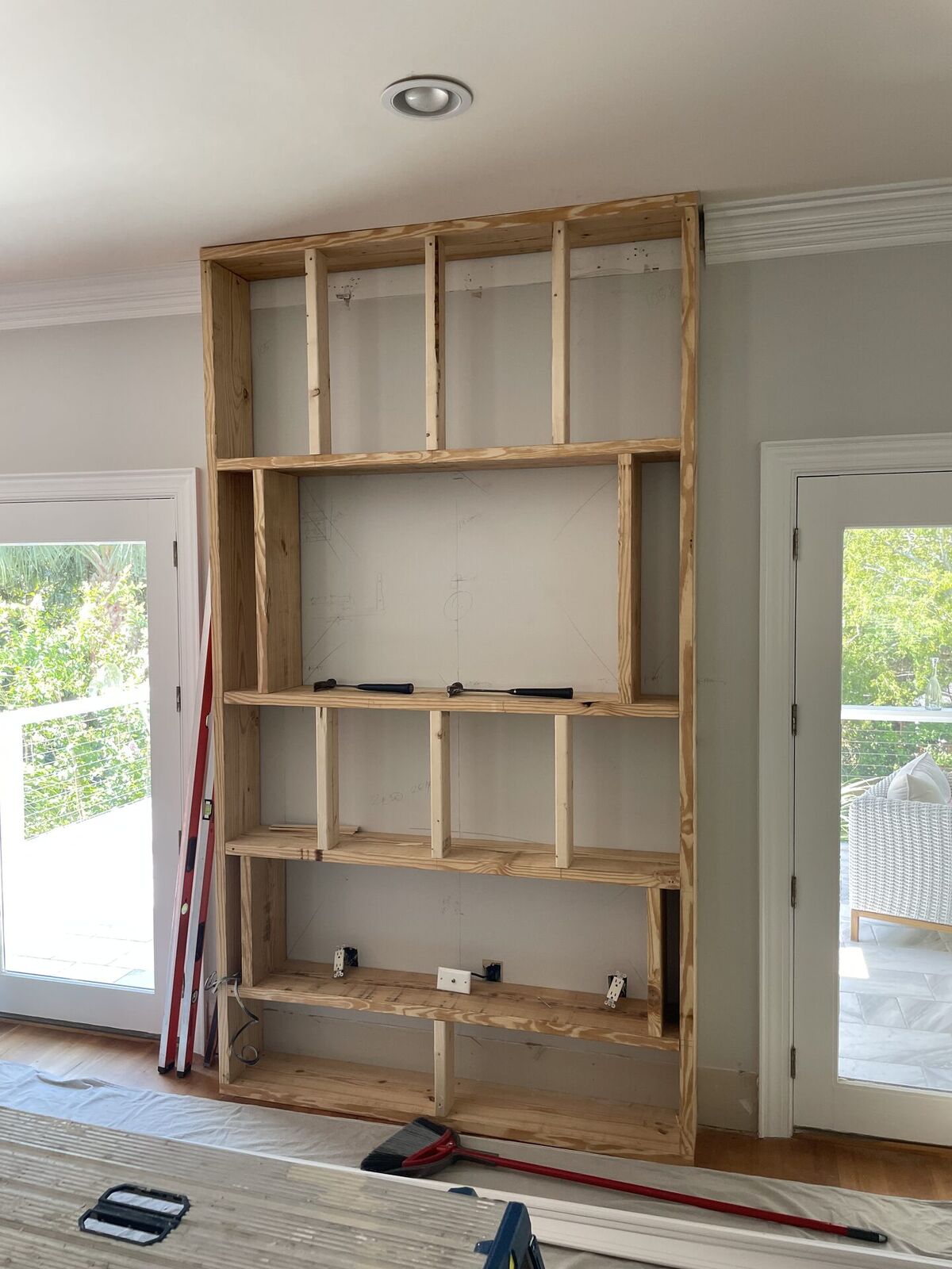 Framing stage of fireplace feature wall by Kickers Low Country Home Creations